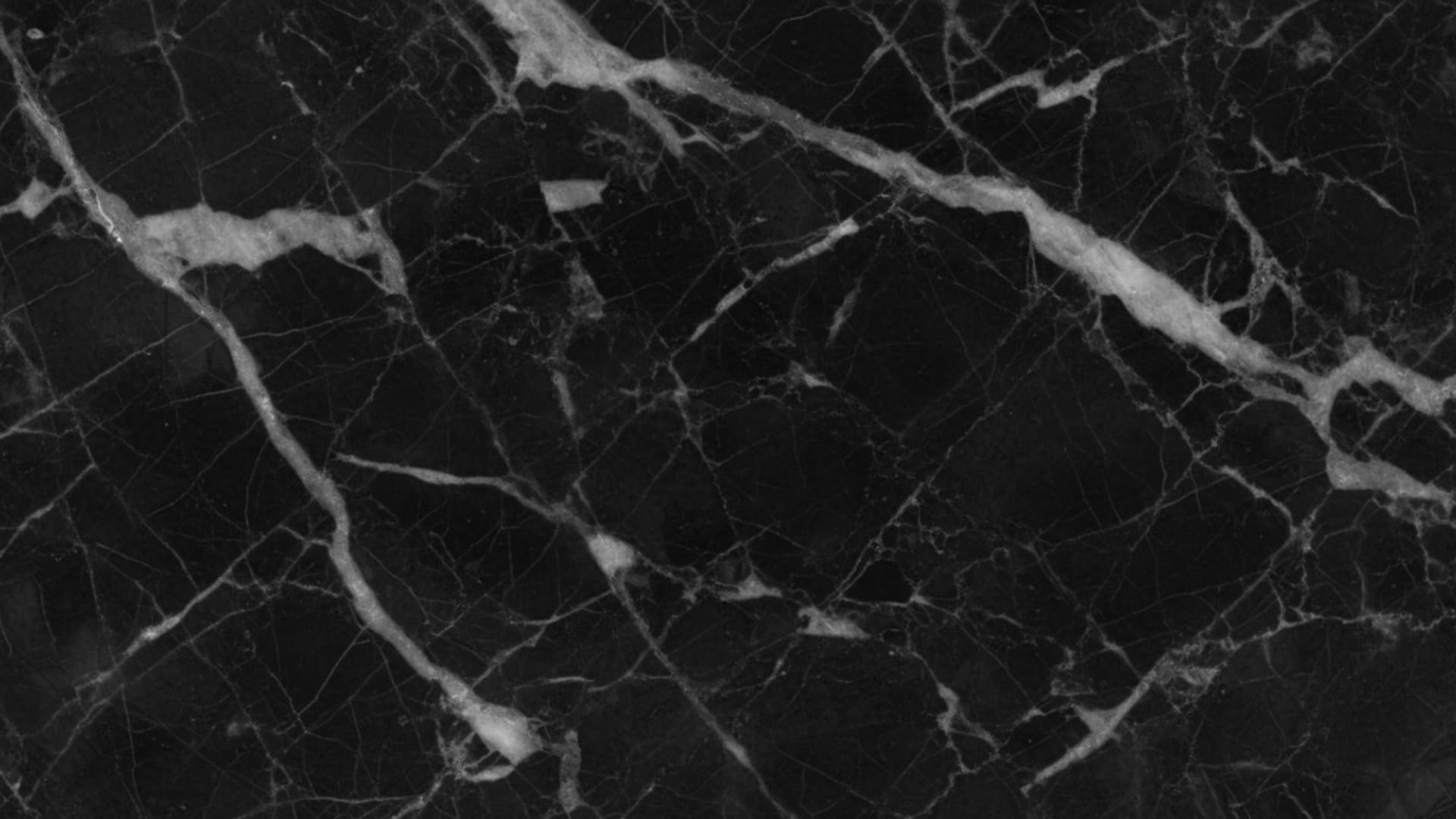 Texture marbre monochrome avec veines sur fond noir et blanc, fond ecran de luxe pour bureau.