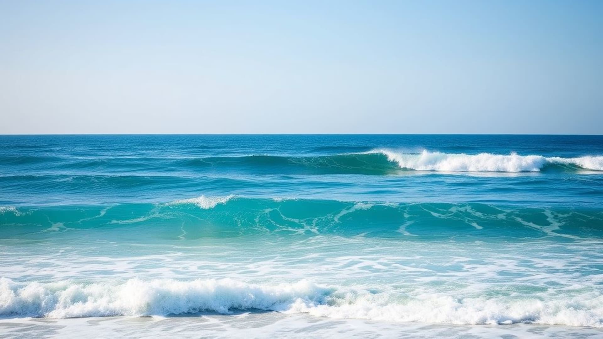 fond ecran de vagues oceaniques bleu profond turquoise écume horizon lumière solaire paysage marin paisible apaisant