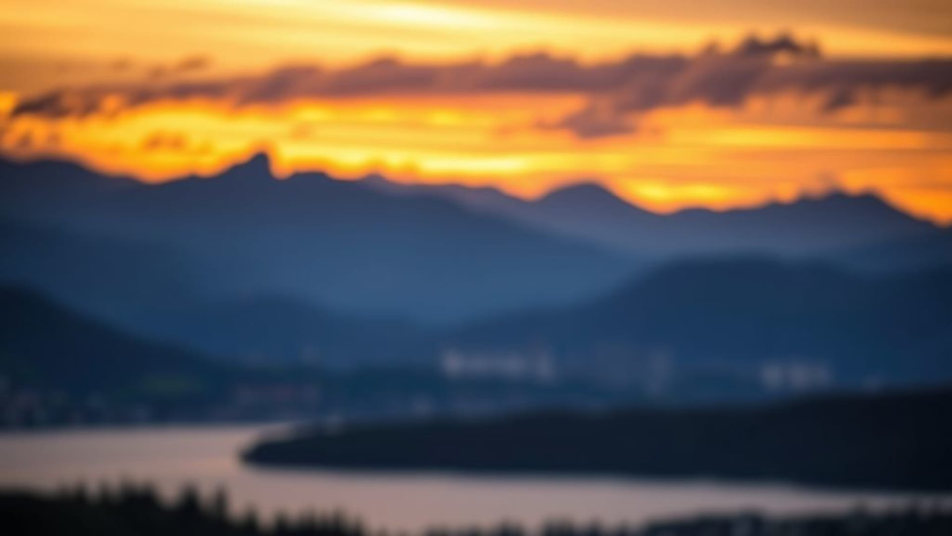 coucher de soleil montagnes lac calme paysage bokeh nuages tons chauds heure dorée fond d'écran nature sérénité